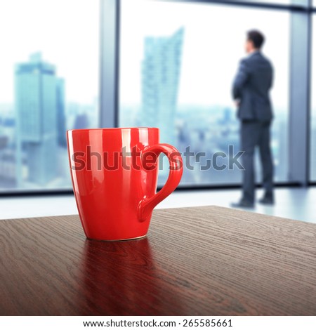 red mug dark desk and office space