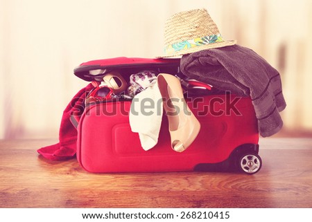 open red suitcase and floor with window