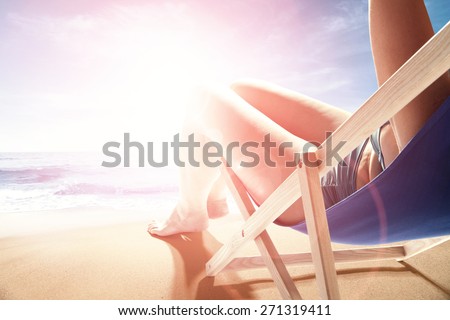 summer sun light with beach and sea and woman on chair