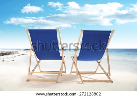 blue sky and sand and two chairs of summer day