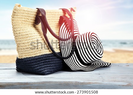 sun hat big bag and blue desk top