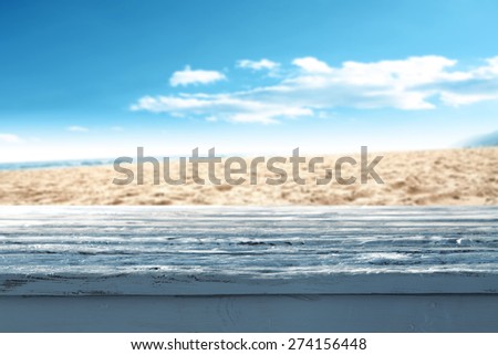 blue desk top and sand and sky