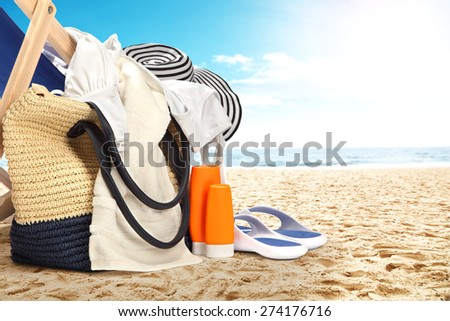 landscape of ocean and beach with closeup of bag