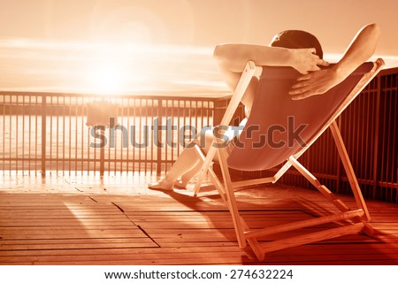 woman on chair and on pier