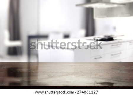 interior of white kitchen and black desk