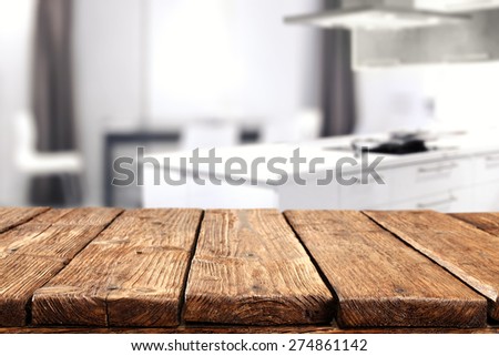interior of white kitchen and dirty old table