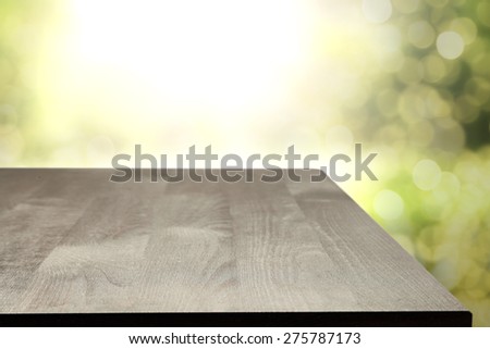 black desk top in green garden