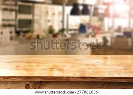 decoration of table and blurred space of kitchen