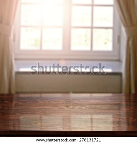 dark brown desk top and window