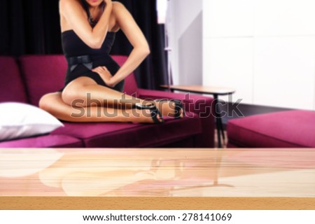woman on red sofa and desk