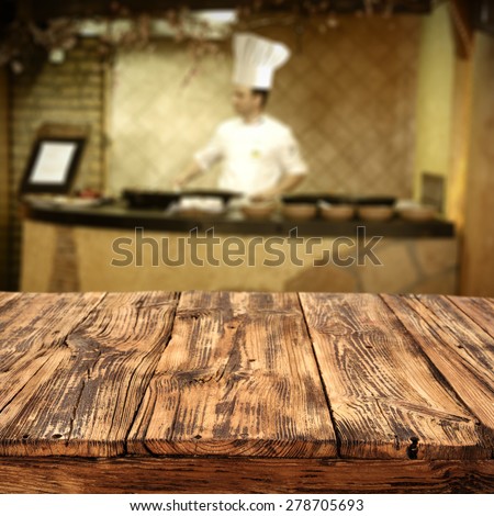 cook hat and man in kitchen and desk
