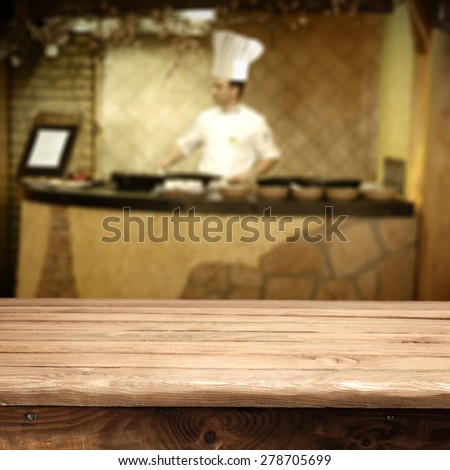 cook hat and man in kitchen and wooden desk space