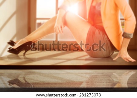 summer sunset with woman on window sill and dark top of free space
