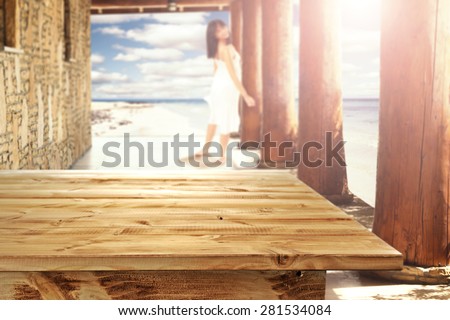 woman in white dress and wooden table place