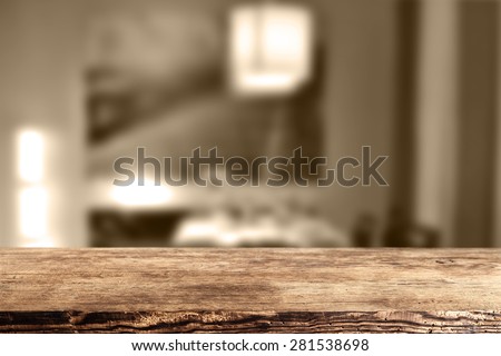 dark brown color of desk and blurred background of home
