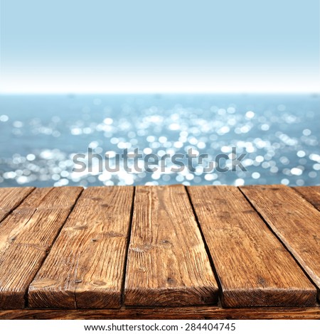 summer blurred sea and sky with dirty old table