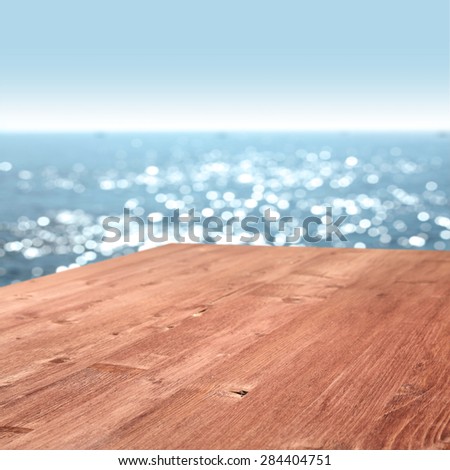 summer blurred sea and sky with red desk