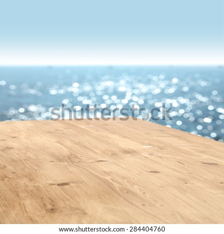 summer blurred sea and sky with wooden top place