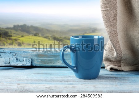 blue window and blue mug