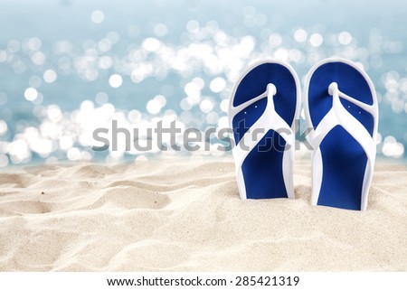 sea of summer day sand and shoes