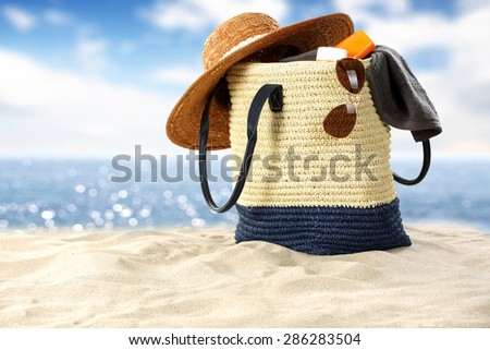 glasses bag and sand and sea