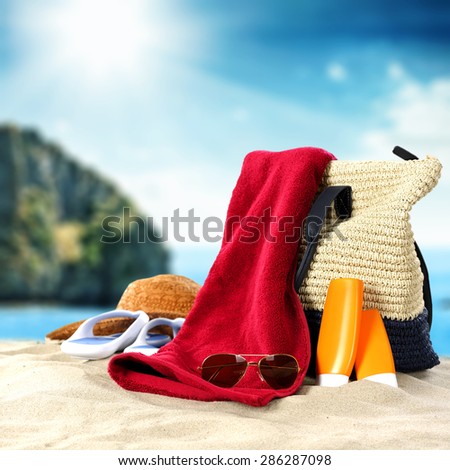 blue summer sky and sea of blue color with towel of red color bag and sand
