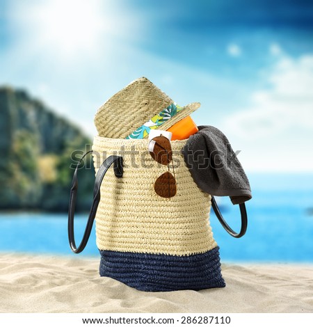 blue summer sky and sea of blue color with hat in bag and glasses