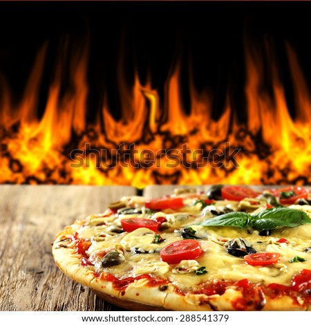 hot pizza on wooden table place