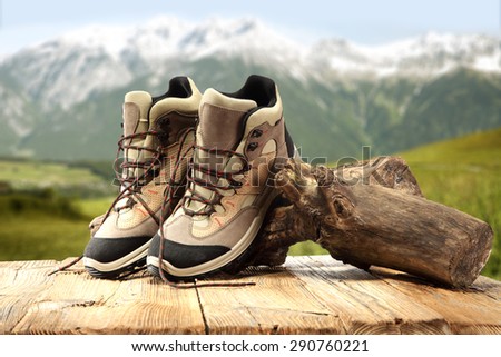 alps and trip and wooden table of shoes