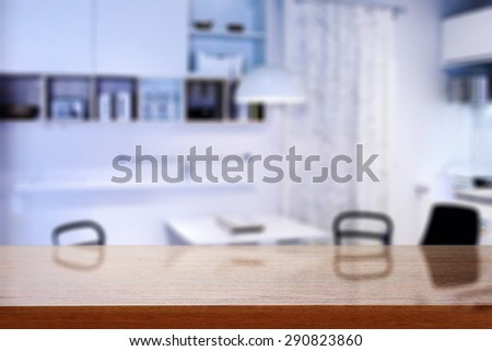 dark brown desk space and kitchen