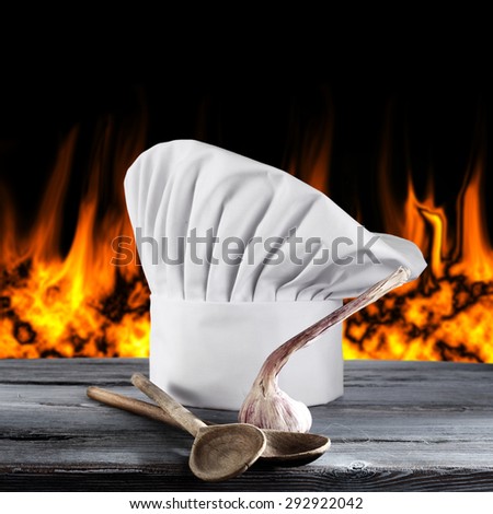 fire spoons and white cook hat
