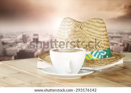 morning landscape of town and book hat and coffee