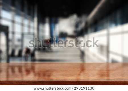 blurred background of gray color and brown desk space for you