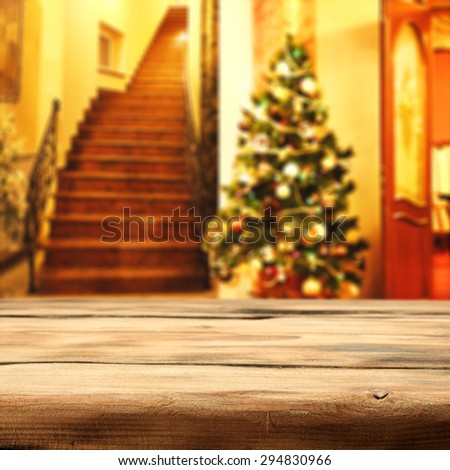 wooden desk space xmas tree and interior of home in xmas time