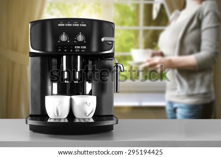 coffee machine woman in gray color and window