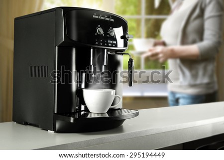 kitchen interior with woman and coffee machine