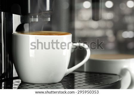 hot fresh coffee and coffee machine and cafe interior