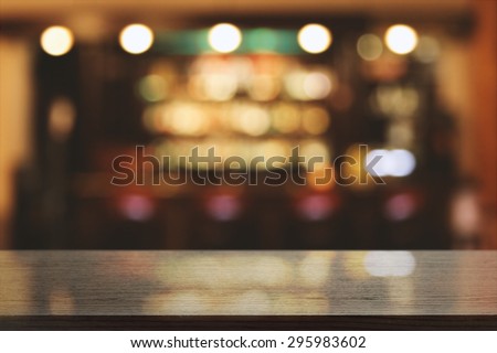 blurred background of bar and black desk space