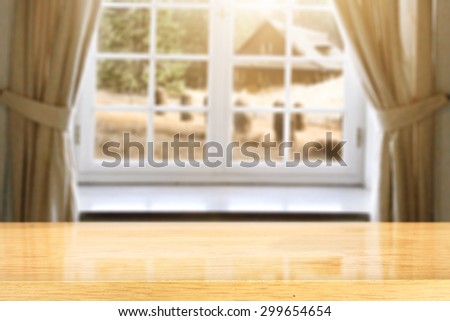 latticed window and brown curtains and yellow wooden sill