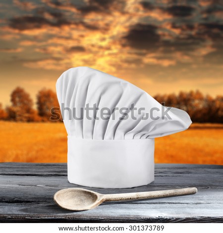 spoon cook hat and white hat with sunset