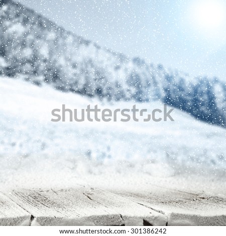 frost snow wooden table of ice and trees of snow landscape