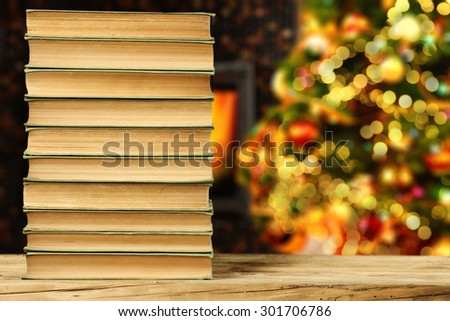 few old books christmas books and lights of tree