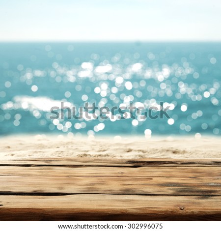 board of wood sand and sea and sky