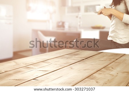 wooden desk space and sun in kitchen and woman