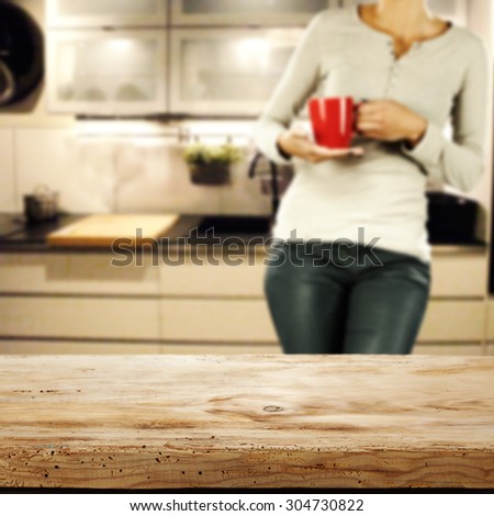 board of wood in kitchen and young woman with red mug space and space for your food on top