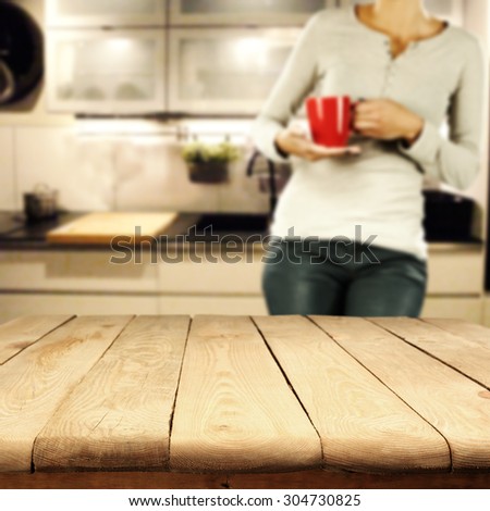 yellow wooden table red mug and woman in white kitchen room and space for your decoration on top