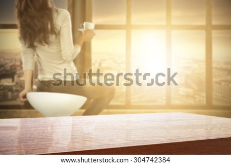 blurred background of big window with city landscape and desk of free space