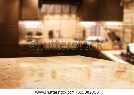 blurred background of red kitchen interior and empty desk top place