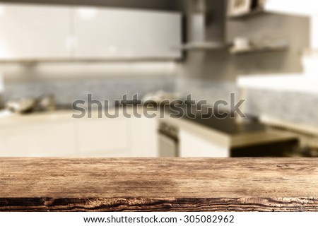 blurred background of kitchen and brown wooden desk of retro chic and space for you