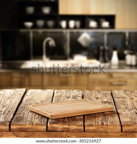 blurred texture of brown kitchen interior with brown kitchen desk on retro wooden table